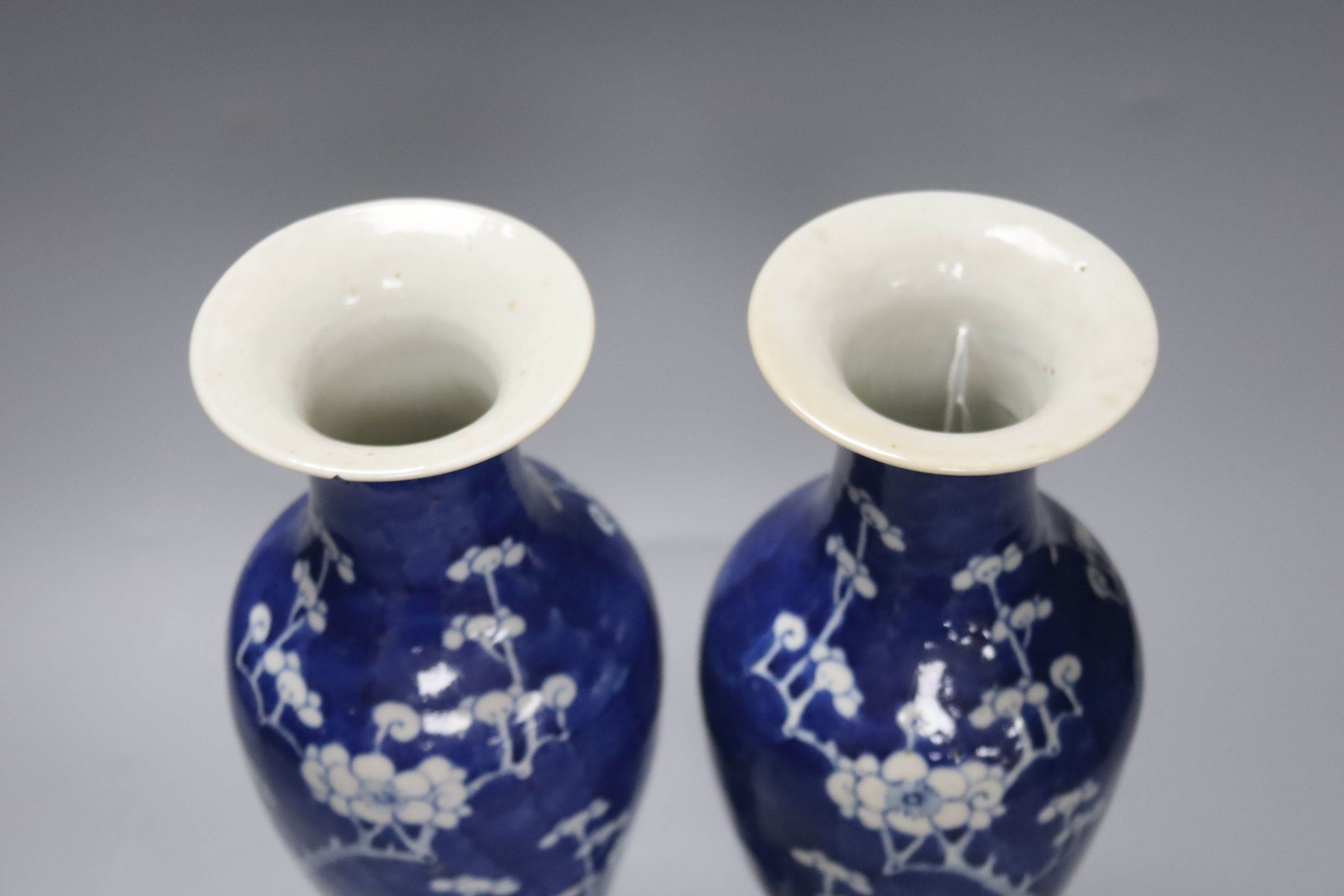 A pair of slender Chinese blue and white prunus vases, late 19th century, height 30cm